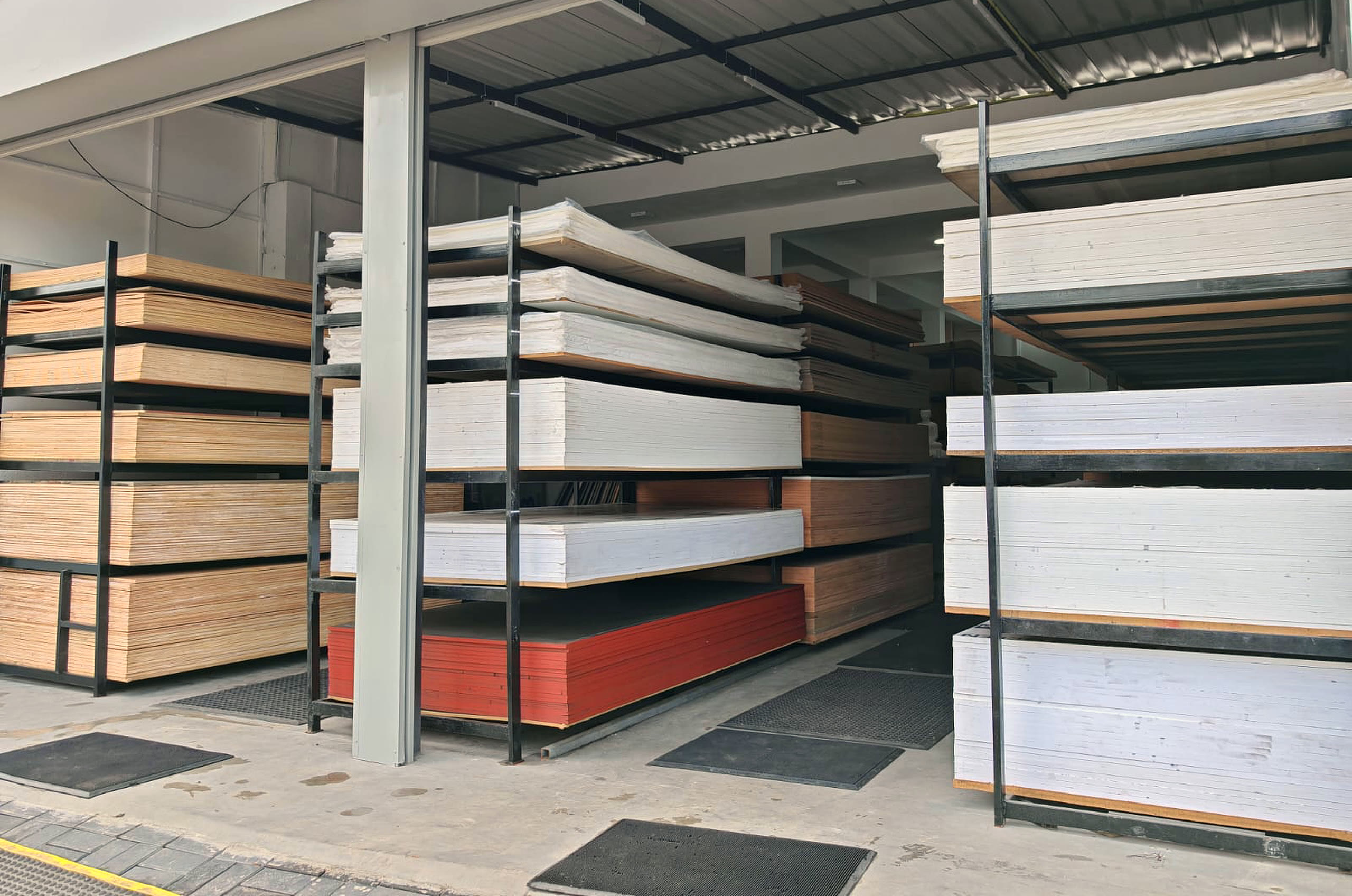 The Greenply Agencies frontage in Piliyandala, with board racks under a covered canopy at the kerbside.